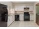 A black appliance suite complements the bright white cabinetry and tile floors in this home kitchen at 1282 Shiloh Trail E, Kennesaw, GA 30144