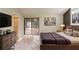 Serene main bedroom with sliding glass doors, television, and stylish gray decor at 1282 Shiloh Trail E, Kennesaw, GA 30144