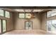 Sun room with wood flooring, skylights, windows, ceiling fan and access to deck at 1282 Shiloh Trail E, Kennesaw, GA 30144