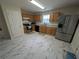 Modern kitchen with stainless steel appliances, granite countertops, and tile flooring at 2234 Oakland Springs Dr, Snellville, GA 30039