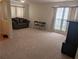 Bright living room with neutral carpet, natural light, and comfortable furnishings at 2234 Oakland Springs Dr, Snellville, GA 30039