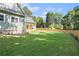 Spacious backyard with well-maintained lawn and new wooden fence at 529 Claude Scott Rd, Canton, GA 30115