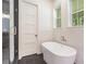 Modern bathroom showcasing a soaking tub and tiled walls next to the glass enclosed shower at 529 Claude Scott Rd, Canton, GA 30115