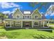 Charming two-story home featuring a large, inviting front porch and well-manicured lawn at 529 Claude Scott Rd, Canton, GA 30115