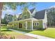 Beautiful home with a covered porch, lush lawn, and attractive landscaping at 529 Claude Scott Rd, Canton, GA 30115