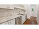 Kitchenette area featuring stainless appliances, a white tiled backsplash, and modern fixtures at 529 Claude Scott Rd, Canton, GA 30115