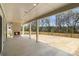 Covered patio with an outdoor fireplace and spacious yard, perfect for entertaining or relaxation at 529 Claude Scott Rd, Canton, GA 30115