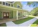 Close-up of a charming porch with white columns, double front doors, and well-maintained lawn at 529 Claude Scott Rd, Canton, GA 30115