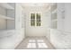 Spacious walk-in closet with custom shelving, cabinets and drawers at 529 Claude Scott Rd, Canton, GA 30115
