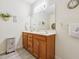 Well-lit bathroom with double sinks, wooden vanity, and tasteful decor at , Buford, GA 30518