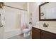 Well-lit bathroom with a tub/shower combination, vanity with cabinet, and neutral color scheme at , Buford, GA 30518