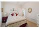 Cozy bedroom featuring a bed with patterned comforter, bedside table, and doorway at , Buford, GA 30518