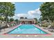 Community pool featuring lounge chairs and umbrellas for a relaxing outdoor experience at , Buford, GA 30518