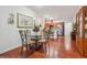 Elegant dining area with hardwood floors adjacent to a modern kitchen, perfect for entertaining at , Buford, GA 30518