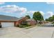 Brick single-story home with an attached garage and well-maintained landscaping at , Buford, GA 30518