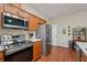 Modern kitchen featuring stainless steel appliances, wood cabinets, and a functional layout at , Buford, GA 30518