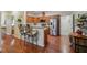 Modern kitchen with stainless steel appliances, granite countertops, and a breakfast bar at , Buford, GA 30518