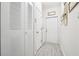 Laundry room area with front load washer and dryer next to storage closets at , Buford, GA 30518
