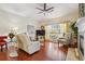 Cozy living room with a fireplace, hardwood floors, and comfortable seating, creating a warm ambiance at , Buford, GA 30518