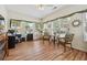 Sunroom featuring several windows, laminate floors, wicker furniture, and ceiling fan at , Buford, GA 30518