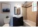 Charming bathroom with a vanity, toilet, bathtub, and tiled walls at 1104 Victory Sw Dr, Atlanta, GA 30310
