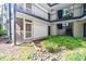 Exterior shot of courtyard with grass and rocks, featuring porch with white picket fence at 1445 Monroe Ne Dr # C32, Atlanta, GA 30324