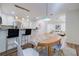 Open dining area with modern lighting, chairs, and bar seating with a kitchen view at 1445 Monroe Ne Dr # C32, Atlanta, GA 30324