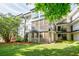 Exterior view of the building with black railings and lush green grass at 1445 Monroe Ne Dr # C32, Atlanta, GA 30324