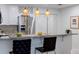 Kitchen bar with granite countertops, stainless steel appliances, and decorative pendant lights at 1445 Monroe Ne Dr # C32, Atlanta, GA 30324