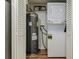 Convenient laundry closet featuring a stacked washer/dryer unit and water heater at 1445 Monroe Ne Dr # C32, Atlanta, GA 30324