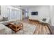 Contemporary living room featuring wood floors, plush sofa, and a stylish coffee table at 1445 Monroe Ne Dr # C32, Atlanta, GA 30324