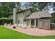 Well-maintained backyard with a brick patio, outdoor seating, and lush landscaping, perfect for entertaining at 300 Stone Mill Trl, Atlanta, GA 30328