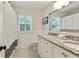 Elegant bathroom with granite countertops, white cabinetry, and tile floors, offering a modern, clean design at 300 Stone Mill Trl, Atlanta, GA 30328