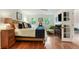 Charming bedroom with wood floors, bright windows, a ceiling fan, and ensuite access at 300 Stone Mill Trl, Atlanta, GA 30328