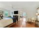 Spacious bedroom with hardwood floors, a ceiling fan, and an open doorway at 300 Stone Mill Trl, Atlanta, GA 30328