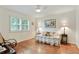 Bedroom featuring hardwood floors, bright window, ceiling fan, and neutral paint at 300 Stone Mill Trl, Atlanta, GA 30328