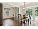 Eat-in dining area featuring a round table and chairs, a large bay window, and a sliding door to laundry room at 300 Stone Mill Trl, Atlanta, GA 30328