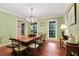 Bright dining room with hardwood floors, large windows, and a charming chandelier at 300 Stone Mill Trl, Atlanta, GA 30328