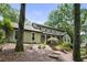 This inviting home features an exterior with mature trees offering shade and natural beauty at 300 Stone Mill Trl, Atlanta, GA 30328