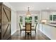 Eat-in kitchen featuring a round table by the bay window and a large sliding door to the laundry room at 300 Stone Mill Trl, Atlanta, GA 30328