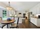 Kitchen dining area features stainless steel appliances and access to eat-in kitchen round table and chairs at 300 Stone Mill Trl, Atlanta, GA 30328