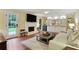 Cozy living room with a fireplace, built-in shelves, and a comfortable seating area at 300 Stone Mill Trl, Atlanta, GA 30328