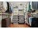 Well-organized walk-in closet with custom shelving, clothing racks, and ample storage space at 300 Stone Mill Trl, Atlanta, GA 30328