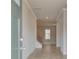 Bright and airy entryway featuring sleek floors and a staircase at 616 Gratton Ln, Mcdonough, GA 30253