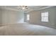 A large bedroom with trey ceilings offers comfort and natural light from two windows at 616 Gratton Ln, Mcdonough, GA 30253