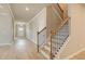 Staircase with wood treads and iron railing, leading to the upper level at 616 Gratton Ln, Mcdonough, GA 30253