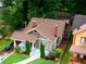 Aerial view of landscaped yard and classic home with mature landscaping at 1232 Lucile Sw Ave, Atlanta, GA 30310