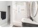 Stylish bathroom with a decorative vanity, marble countertops, and a shower with decorative curtain at 1232 Lucile Sw Ave, Atlanta, GA 30310
