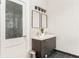 Stylish bathroom with a double sink vanity, modern fixtures, and attractive tile flooring at 1232 Lucile Sw Ave, Atlanta, GA 30310