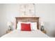 Bedroom with wood headboard, nightstands, lamps, and crisp bedding for a welcoming space at 1232 Lucile Sw Ave, Atlanta, GA 30310